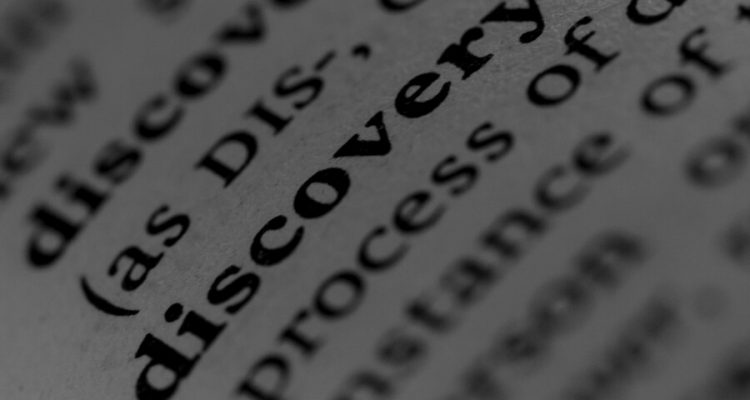 The word discovery in focus with other text in the dictionary out of focus