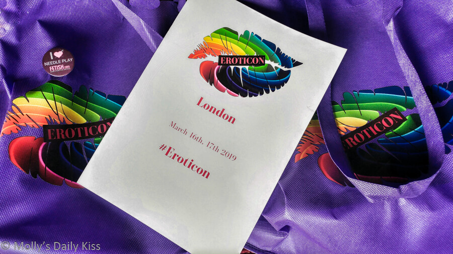 eroticon purple bags with 2019 program laid across the top