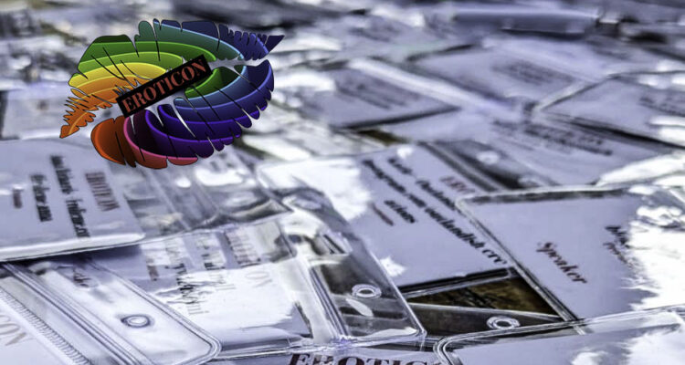 Lanyards on the table with Eroticon rainbow lips logo